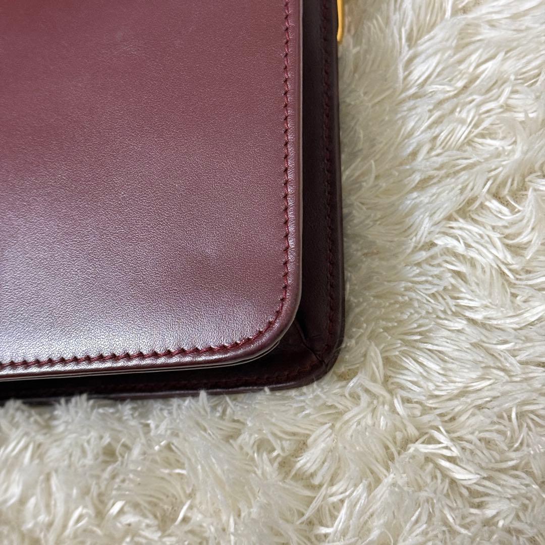 カルティエ　マストライン　クラッチバッグ　ボルドー　ロゴ金具