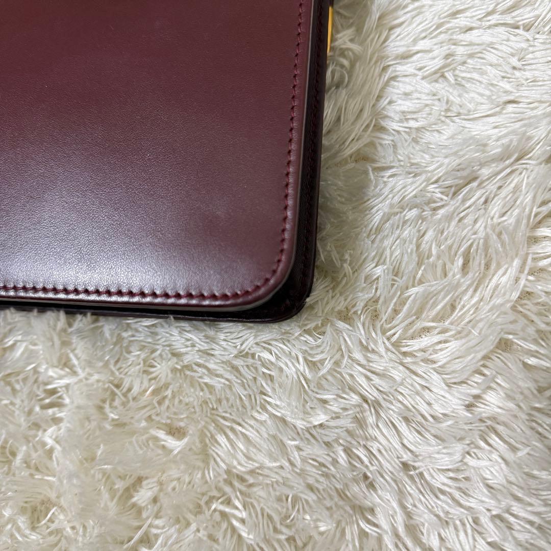 カルティエ　マストライン　クラッチバッグ　ボルドー　ロゴ金具