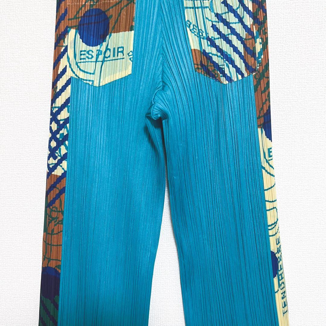 プリーツプリーズ サイドライン　パンツ　柄付き　裾フレア　ポケット　幾何学